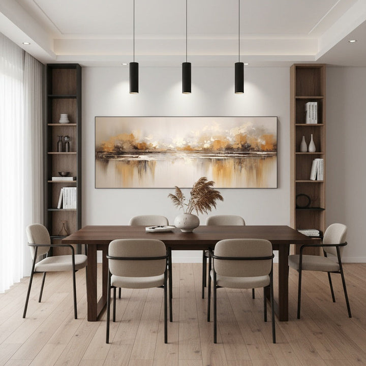 Modern dining room with wooden table and chairs, abstract painting on the wall, and pendant lights.