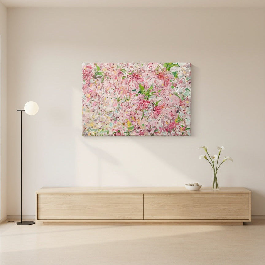 Floral painting on a wall above a wooden cabinet in a minimalistic room.
