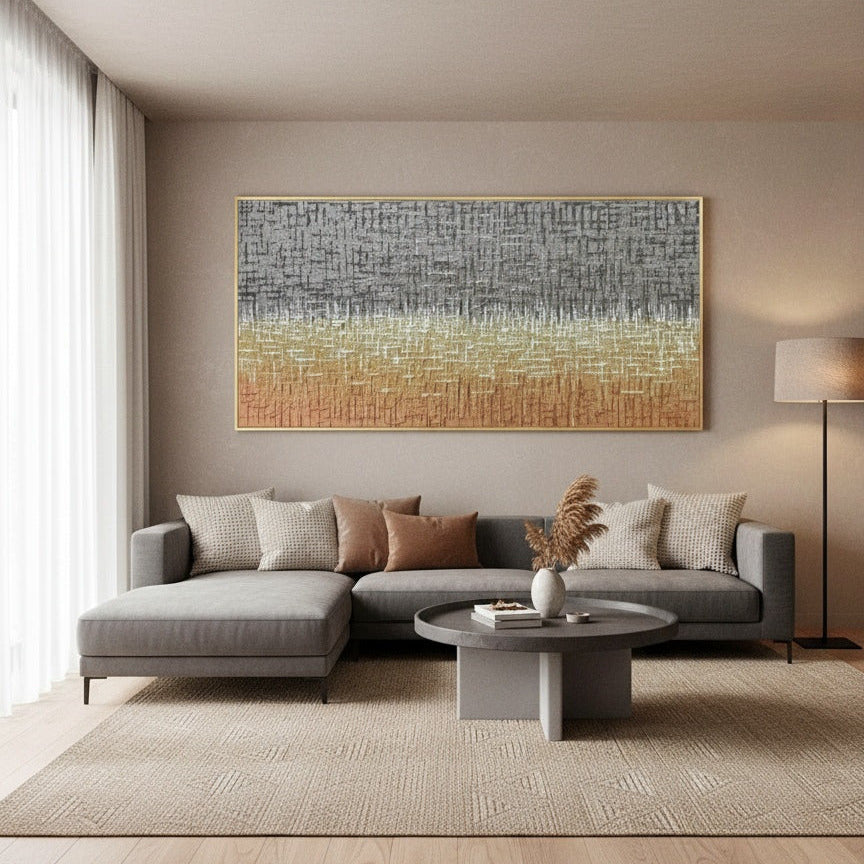 Modern living room with a gray sectional sofa, round coffee table, and abstract painting on the wall.