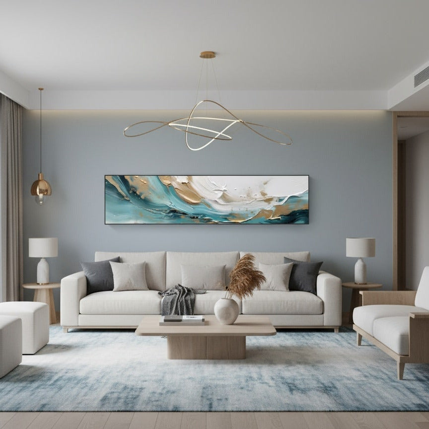 Modern living room with a gray sofa, coffee table, and abstract painting on the wall.