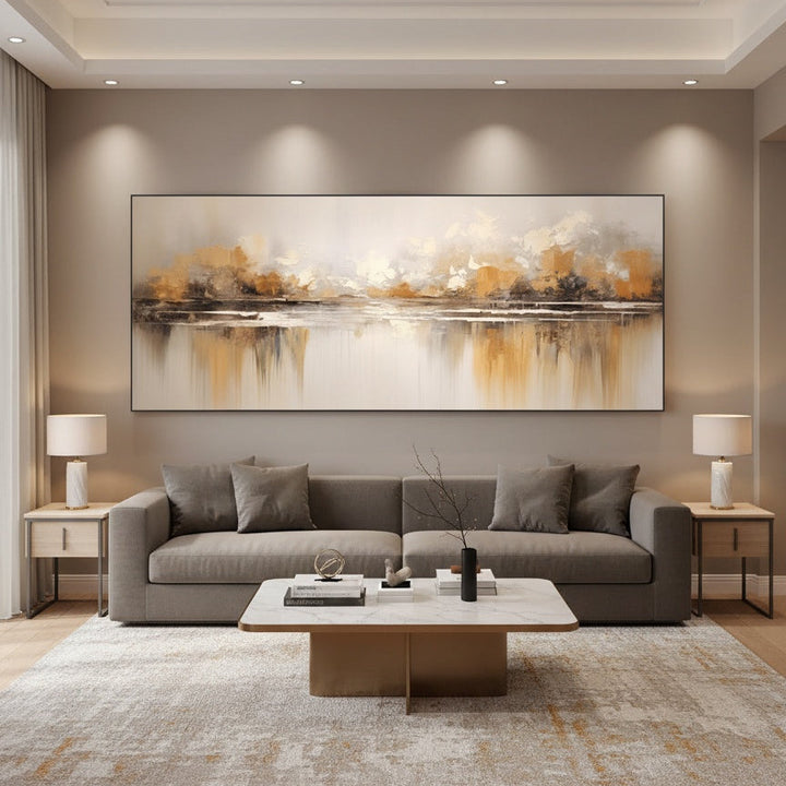 Modern living room with a gray sofa, coffee table, and abstract painting on the wall.